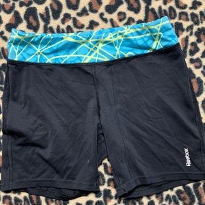 Black and green athletic shorts.